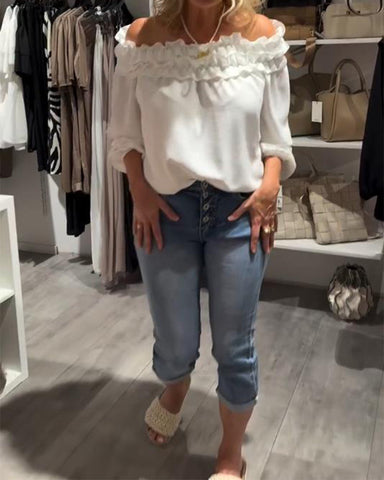 Elegancka bluzka z odkrytymi ramionami i falbanką