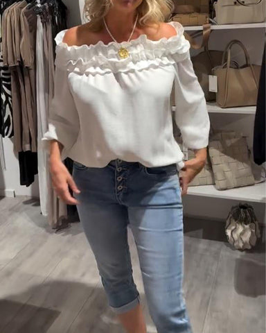 Elegancka bluzka z odkrytymi ramionami i falbanką