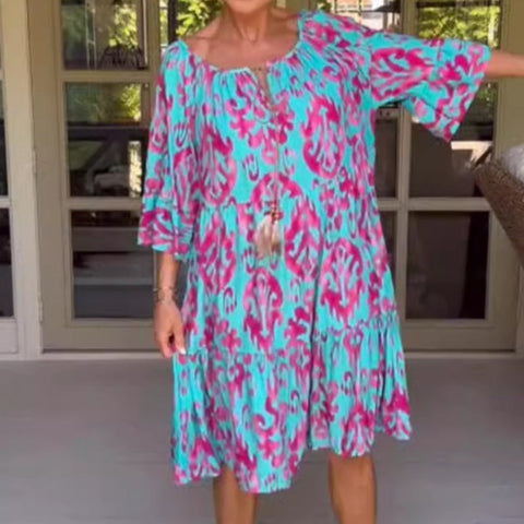 Damska luźna sukienka midi z falbaniastym dołem