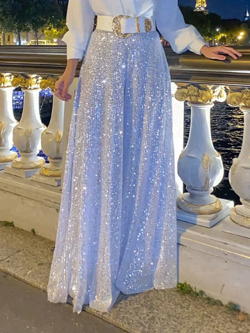 Elegancka koszula z długim rękawem i dekoltem w kształcie litery V oraz spodnie z szerokimi nogawkami ozdobionymi cekinami